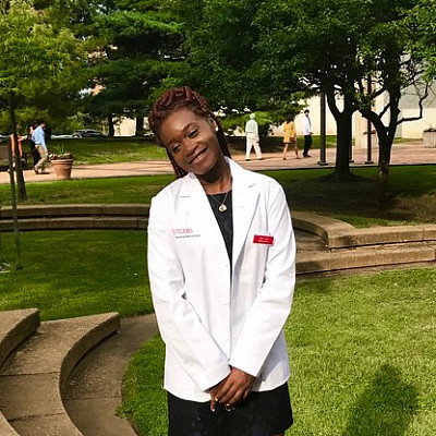 Biology alumna Alice Trye '15 at her medical school white coat ceremony