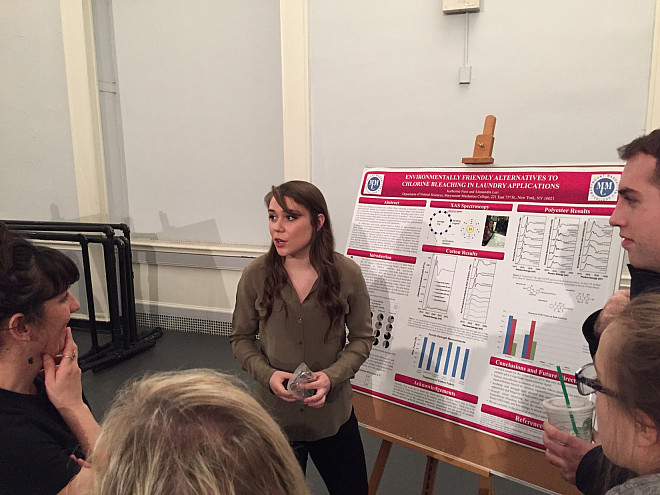 Katie Ness delivers her poster presentation on Environmentally Friendly Alternatives to Chlorine Bleaching in Laundry Applications.