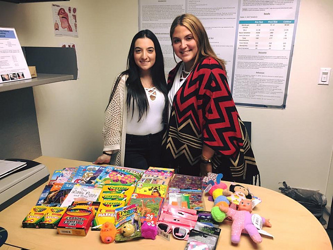 NSSLHA members preparing therapy materials to donate to a Houston-based speech and hearing clinic affected by Hurricane Harvey.