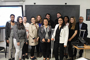 Students in Prof. Kazi Rahman's Diplomacy and Multiculturalism class pose for a photo with UN diplomat Meriem El Hilali (right of center)