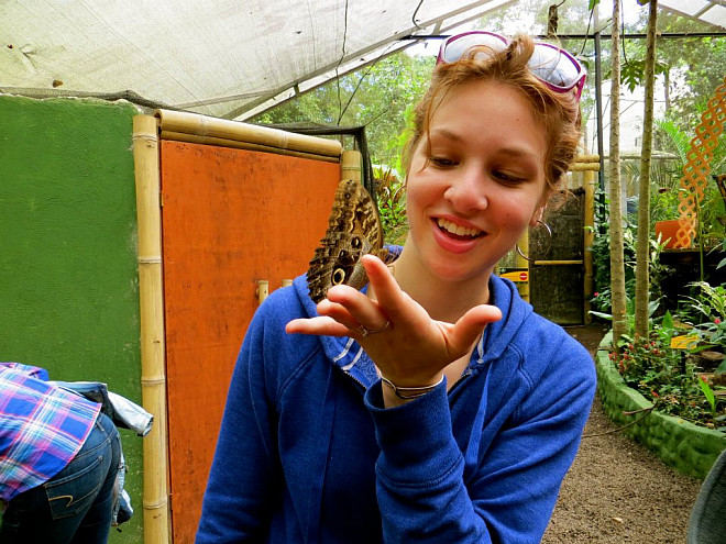 Sarah Brodine makes a friend during her travels in Ecuador.