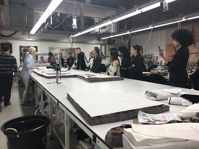 Students at The Factory, Fashion-Enter a London-based manufacturing facility for brands such as ASOS. Here students are shown touring the...