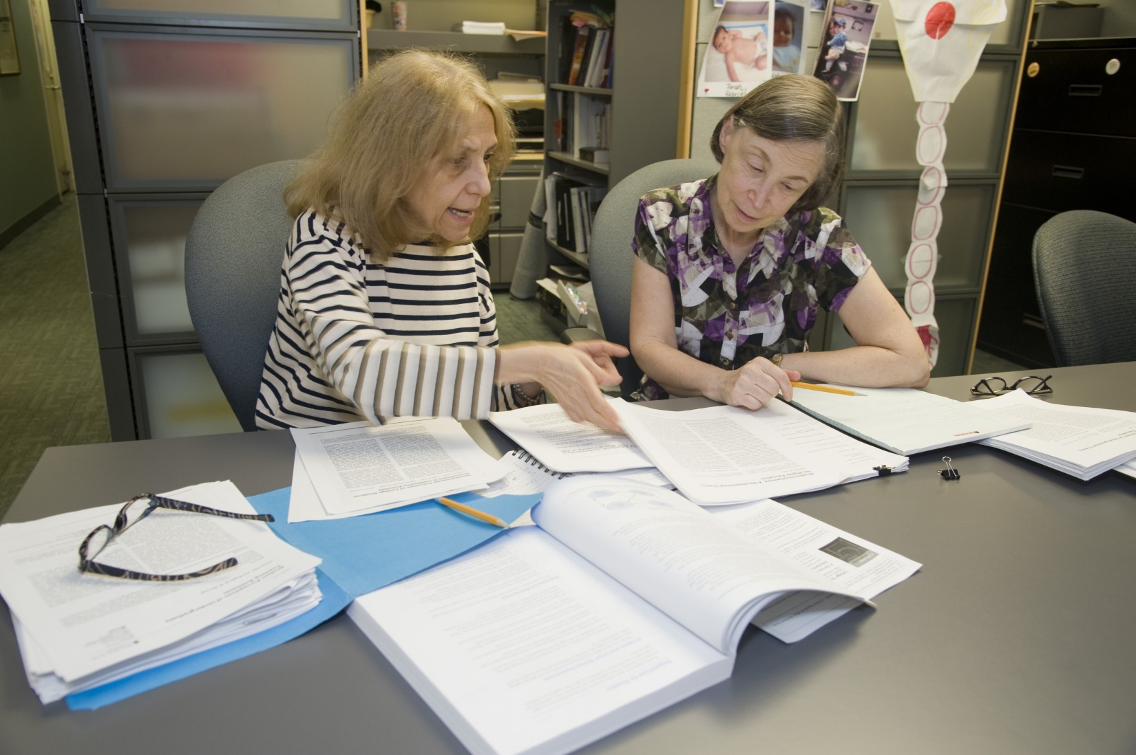 Professors Ann Jablon (CSD) and Linda Solomon (Psychology) work on an interdisciplinary research project