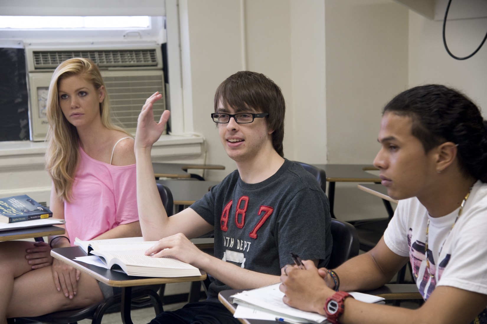 A student shares his perspective in Prof. Feilla's Detective Narratives summer course while classmates listen