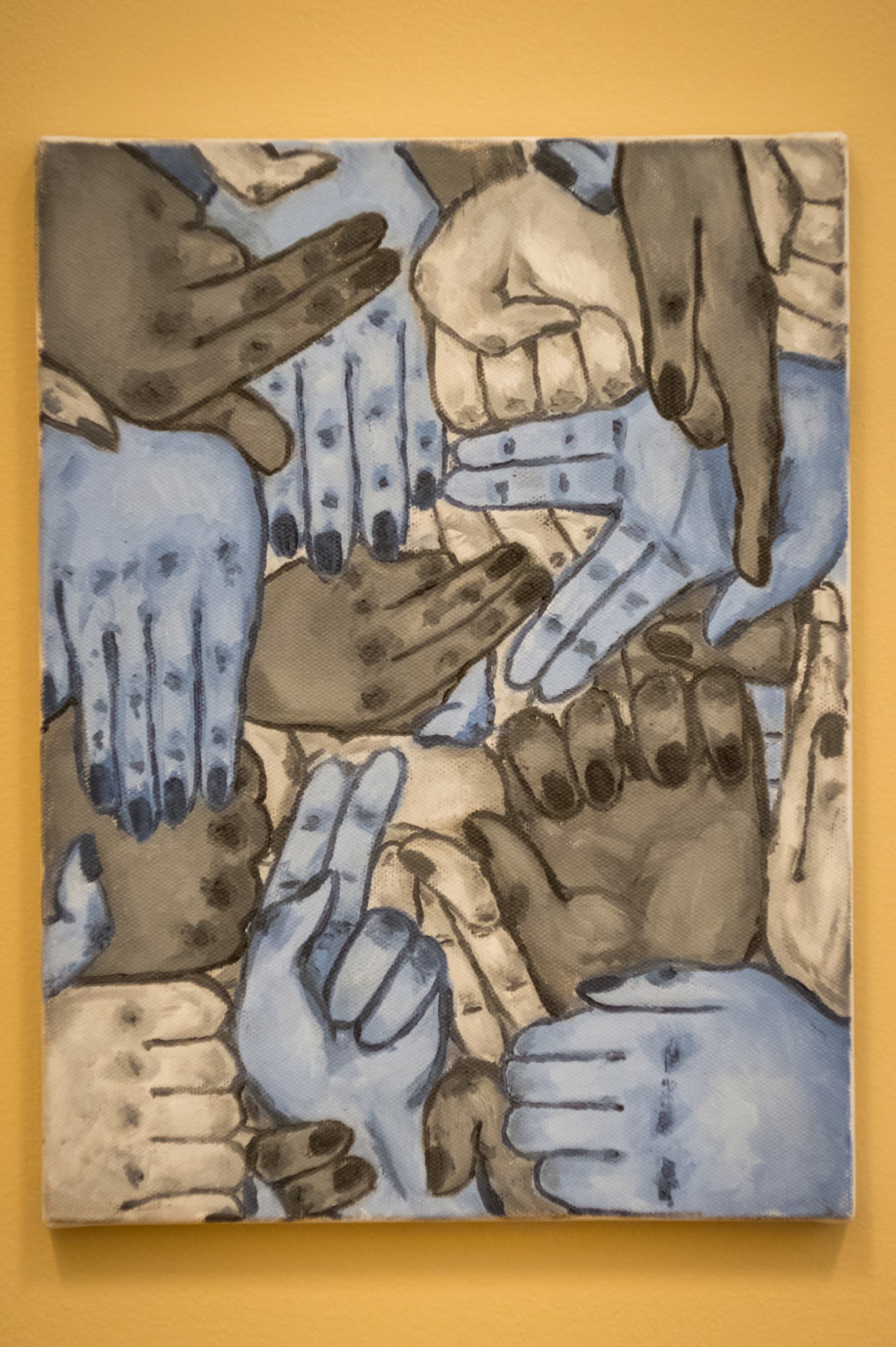 Painting: Many hands coming together to form a pattern