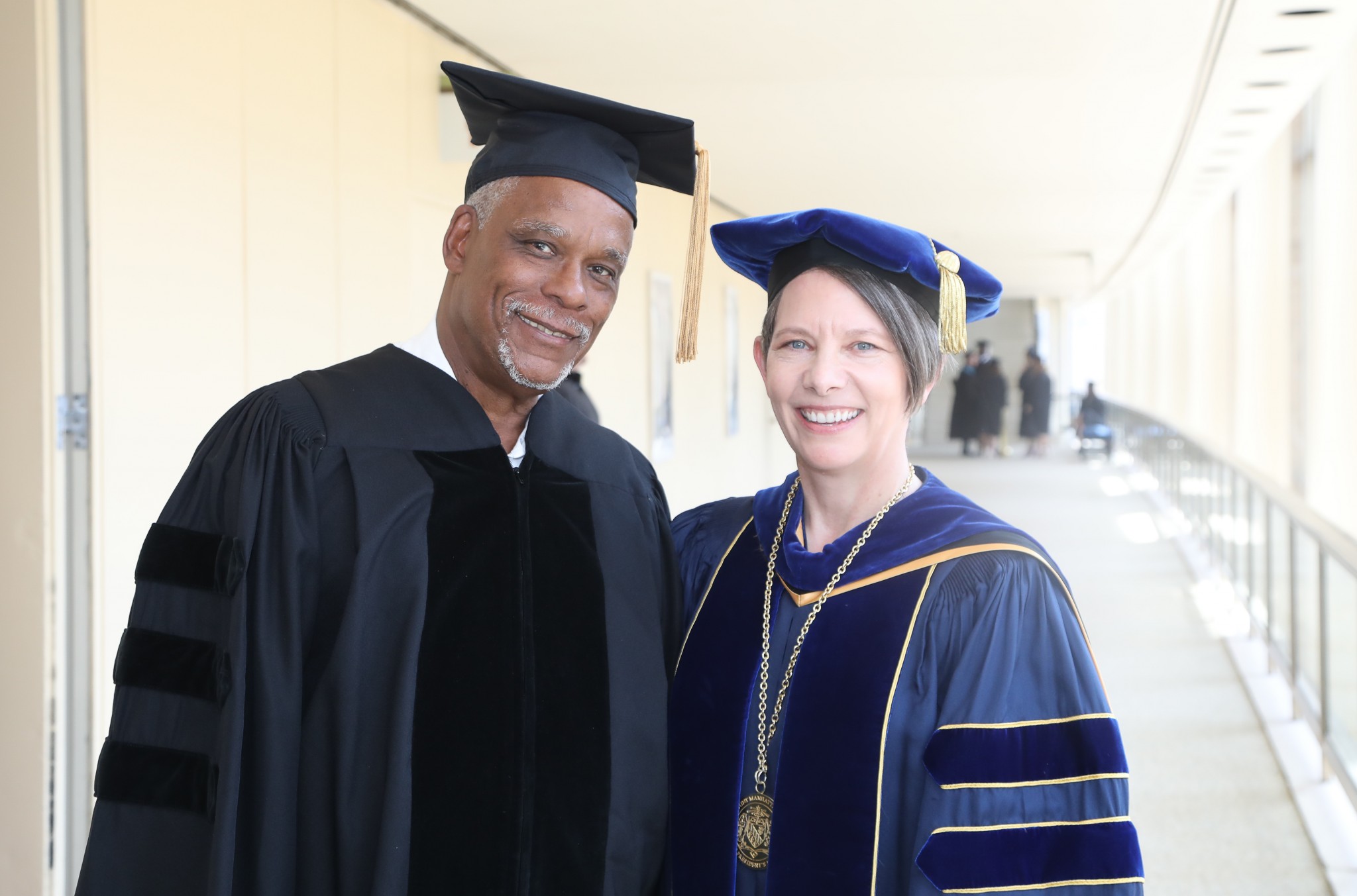 President Kerry Walk at Commencement with Stanley Nelson, honorary degree recipient
