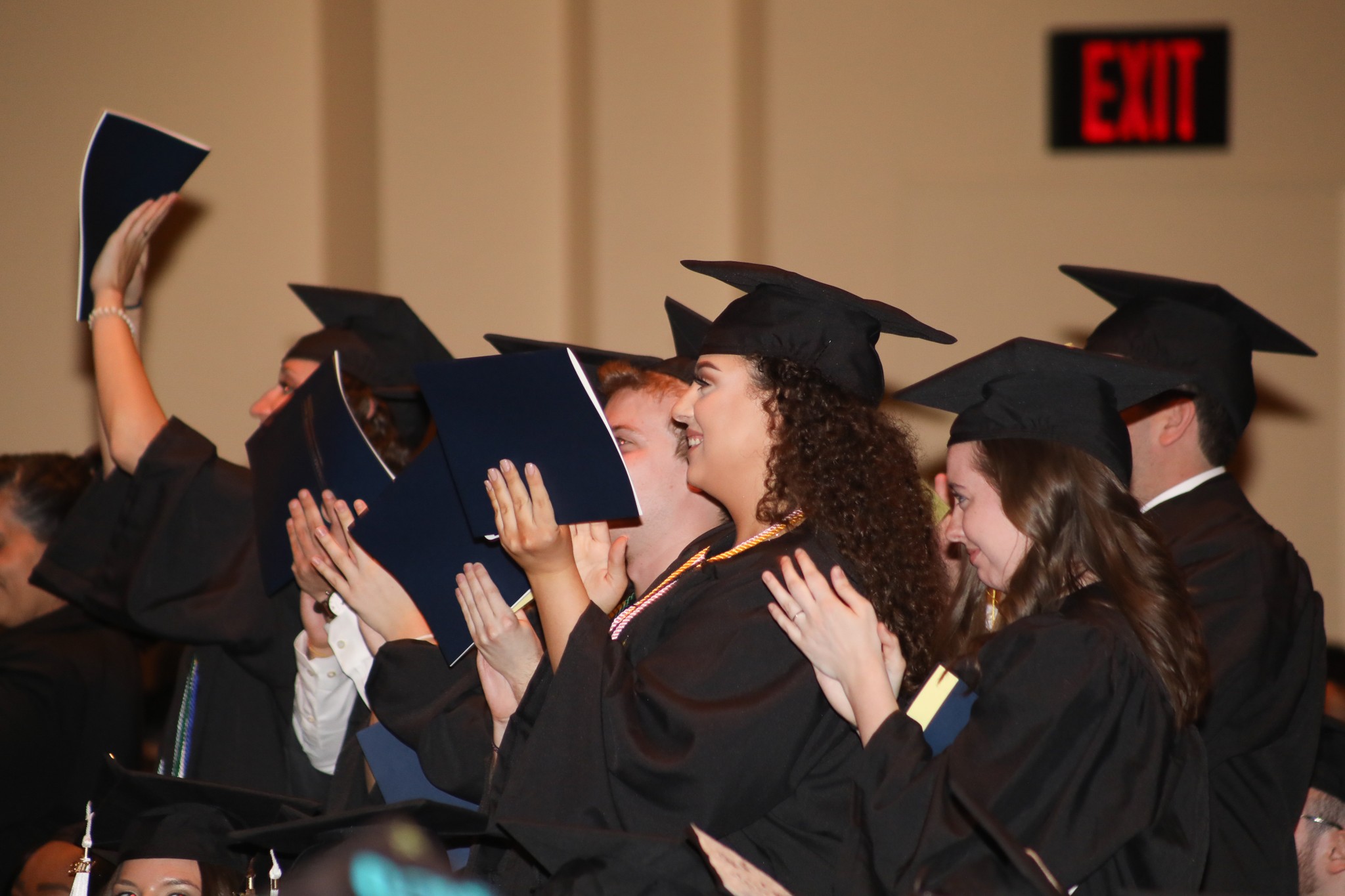 Students applauding for someone being honored at Commencement 2017