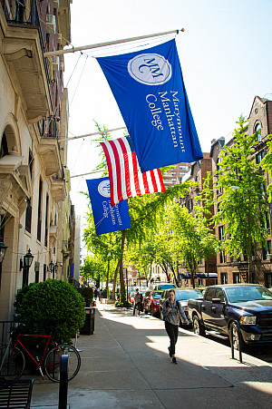 American flag in the middle of two Marymount Manhattan College banners