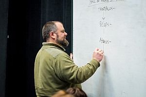 Theater professor writing notes