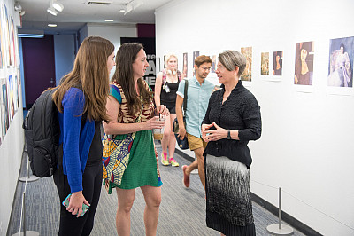 President Walk with students in the Hewitt Gallery of Art