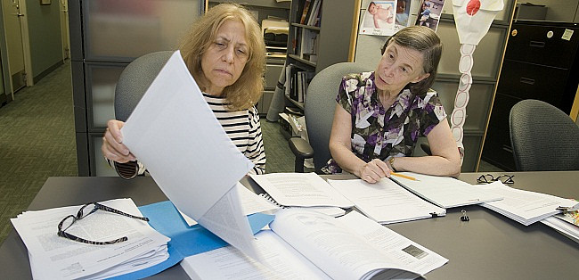 Professors examining data