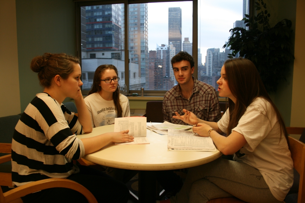 Students discuss class notes in the 12th Floor Study Lounge at 55th Street