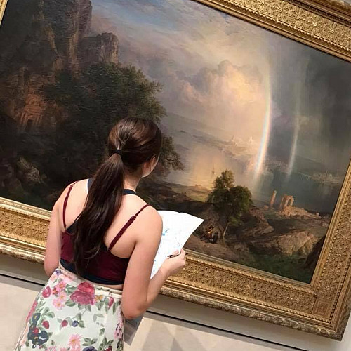Student examines artwork at the Met