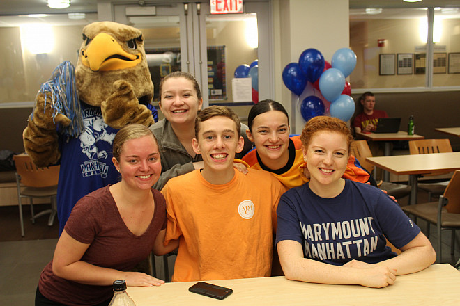 Griffy the Griffin loves going around and visiting students on Griffins Give Day.