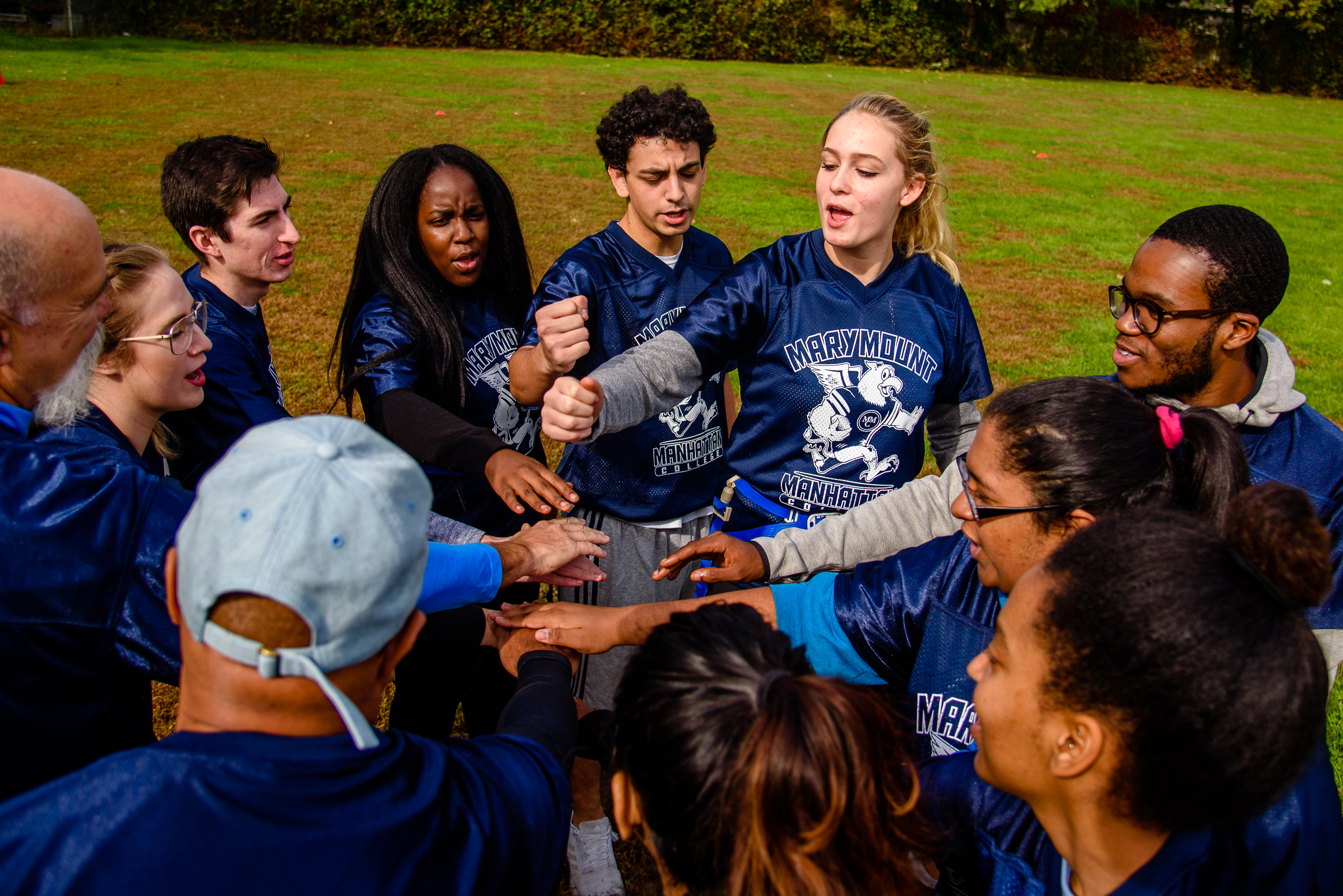 MMC students huddle before the flag football game