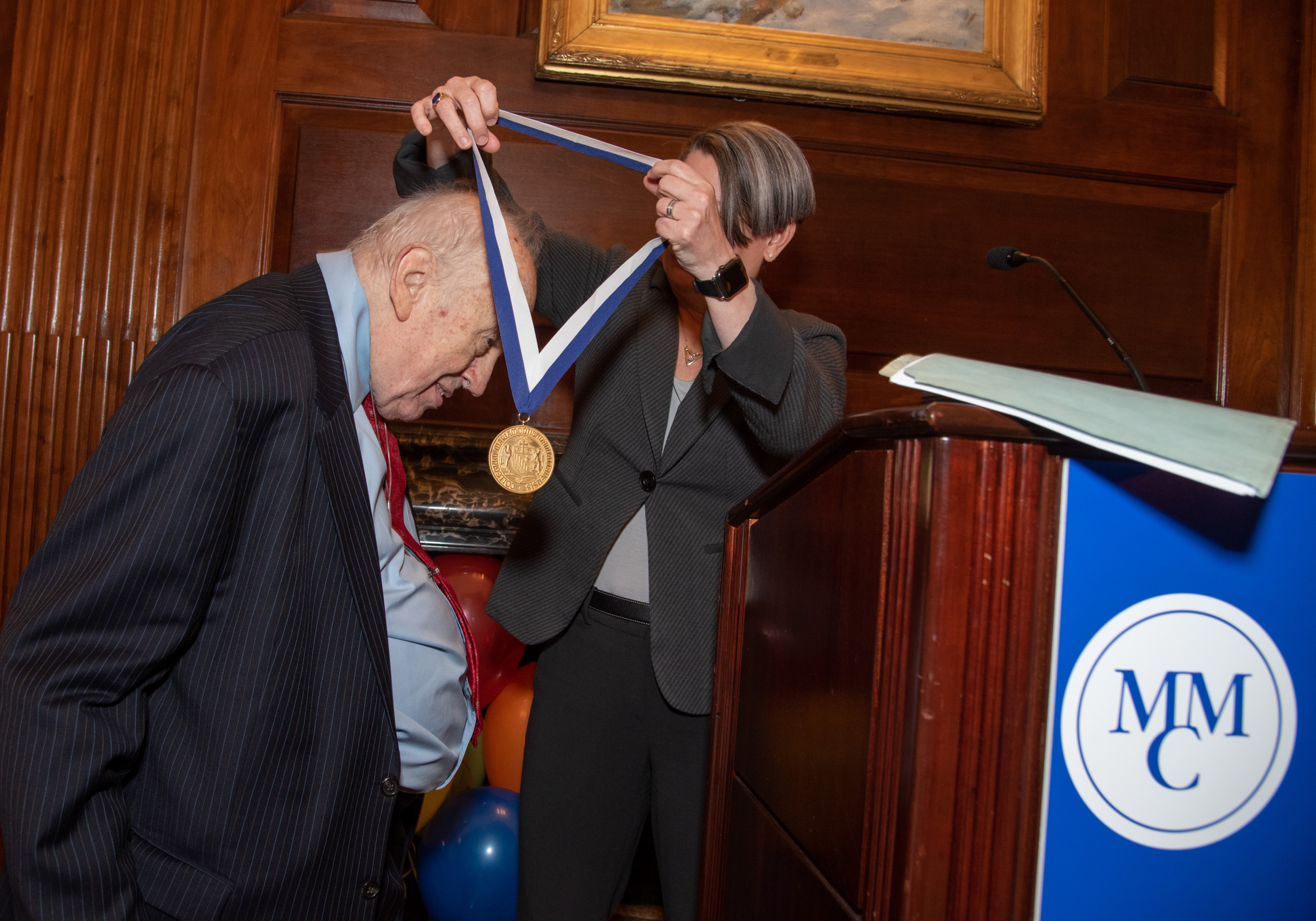 Dean Emeritus Peter H. Baker receives the Legacy Award from President Kerry Walk, Ph.D.