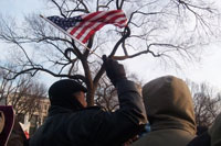 Holly Dougherty '09 snaps a photo of an on-looker waving an American flag during the Presidential Inauguration.