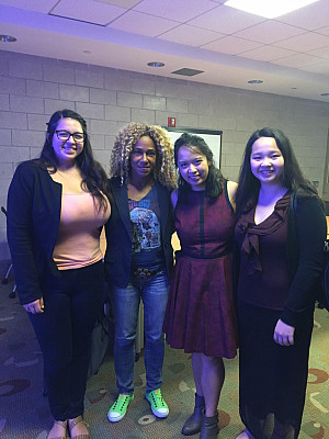 Professor Deirtra Hunter-Romagnoli and Patricia Miraflor (centered) along with two other students who attended the symposium.