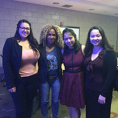 Professor Deirtra Hunter-Romagnoli and Patricia Miraflor (centered) along with two other students who attended the symposium.