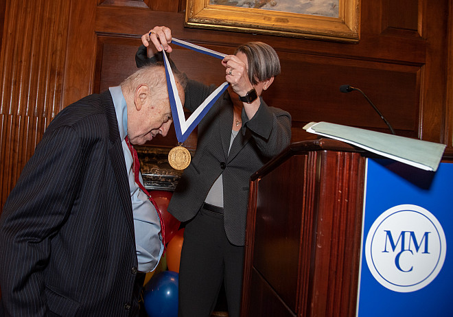 Dean Emeritus Peter H. Baker receives the Legacy Award from President Kerry Walk, Ph.D.