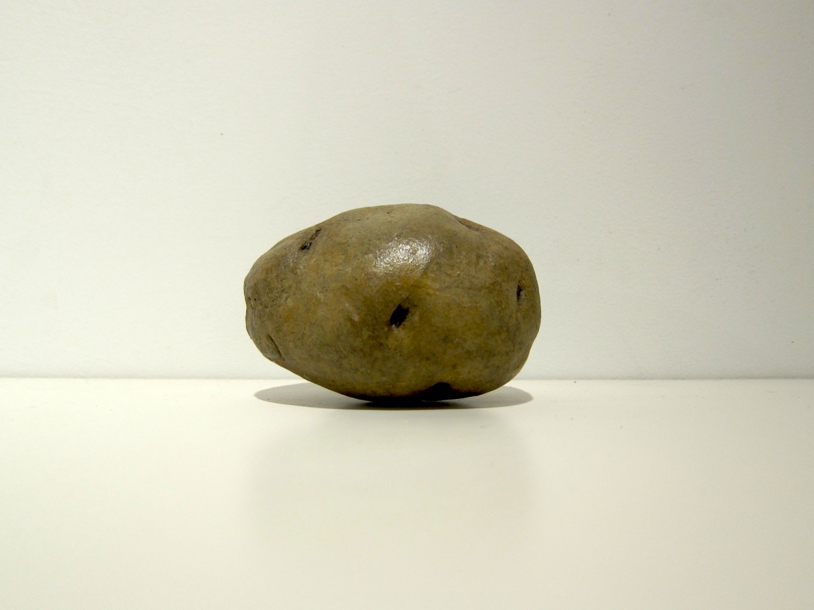 Margaret Lee, Wall Potato, plaster and acrylic paint