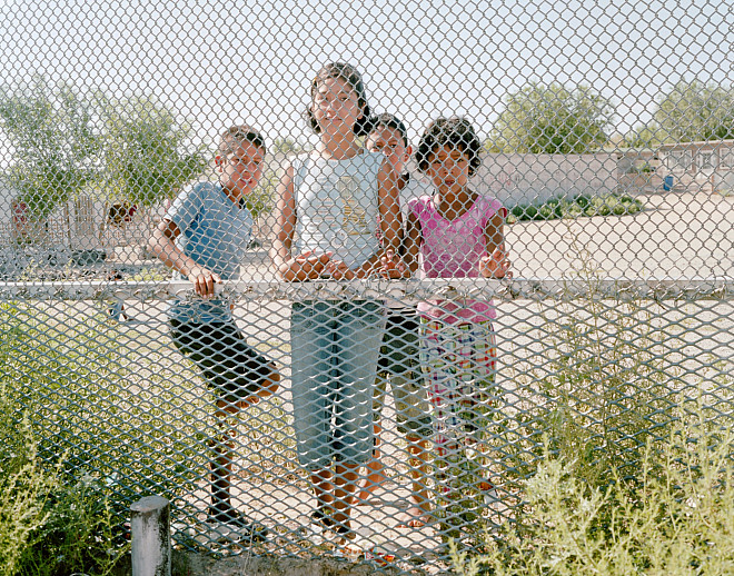 Carl Gunhouse Children in Puerto de Anapra, Mexico through the US Security Fence, Sunland Park, NM, August 2010