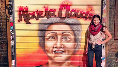 MMC student standing in front of Abuela Claudia sign