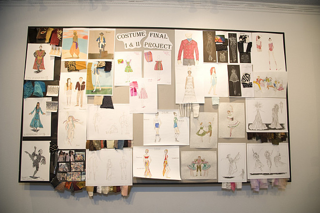 Student costume design work on display outside the Theresa Lang Theatre