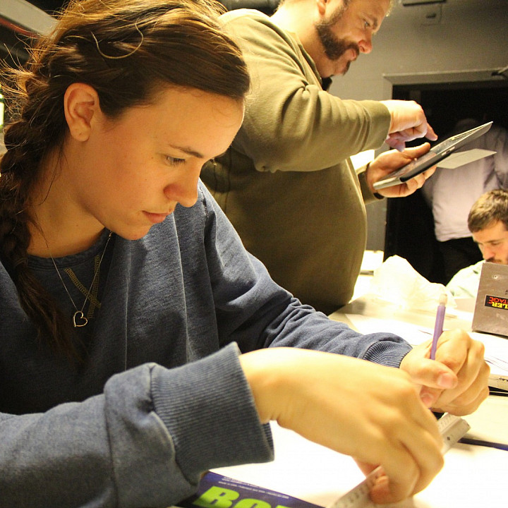 Meghan Mirsch (Design & Technical Production major) in the drafting room with Professor Rob Dutiel